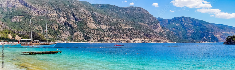 Obraz premium Bay blue lagoon rocks in the Aegean sea Mugla Fethiye Oludeniz ( Dead Sea ) Turkey.