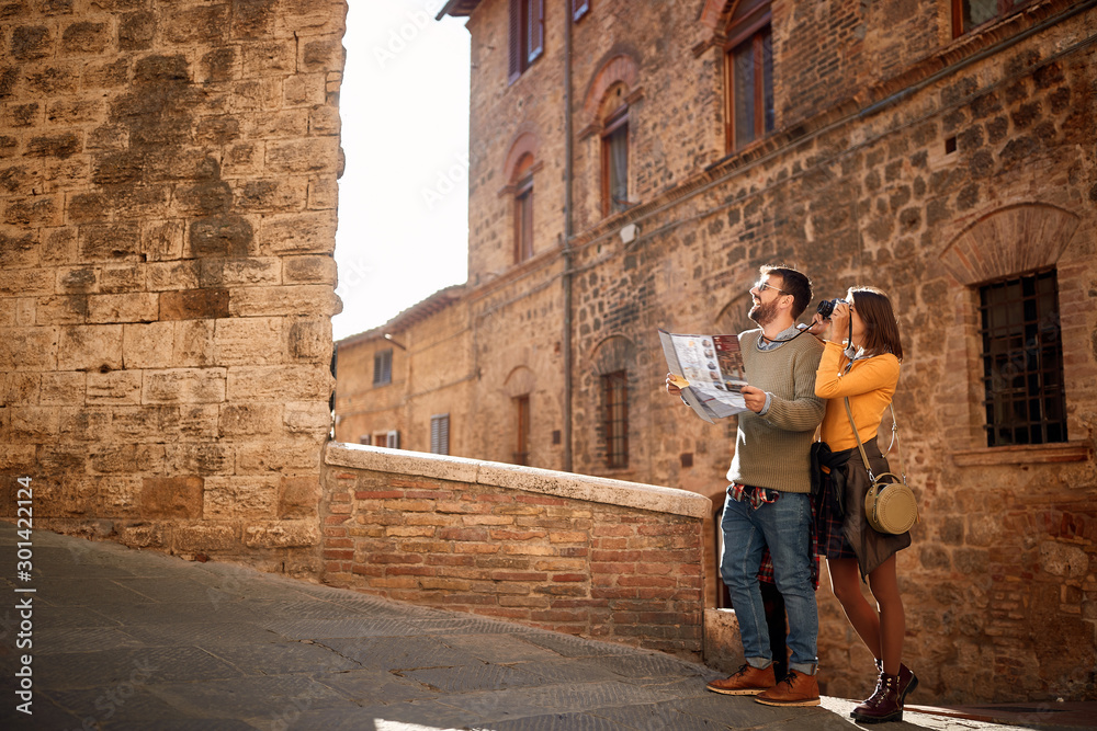 Young couple at the Italy.Happy tourists travelling and enjoying on vacation,