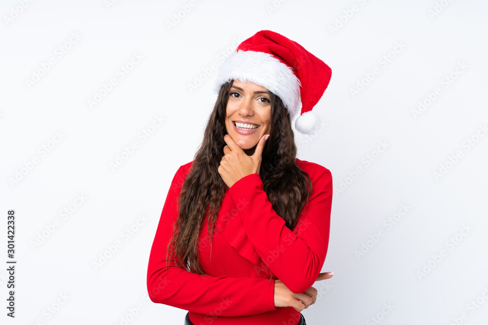 Girl with christmas hat over isolated white background laughing Girl with christmas hat over isolated white background laughing