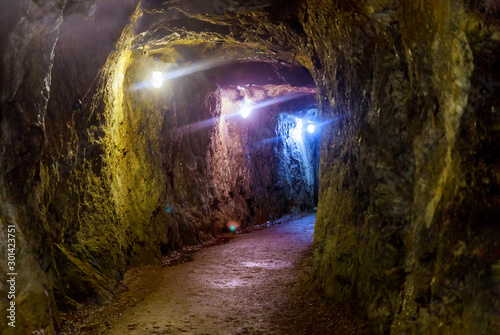 Mining industry underground mine tunnel with lights