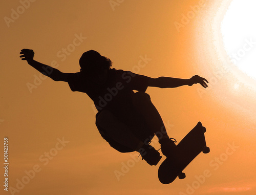silhouette of skateboarder