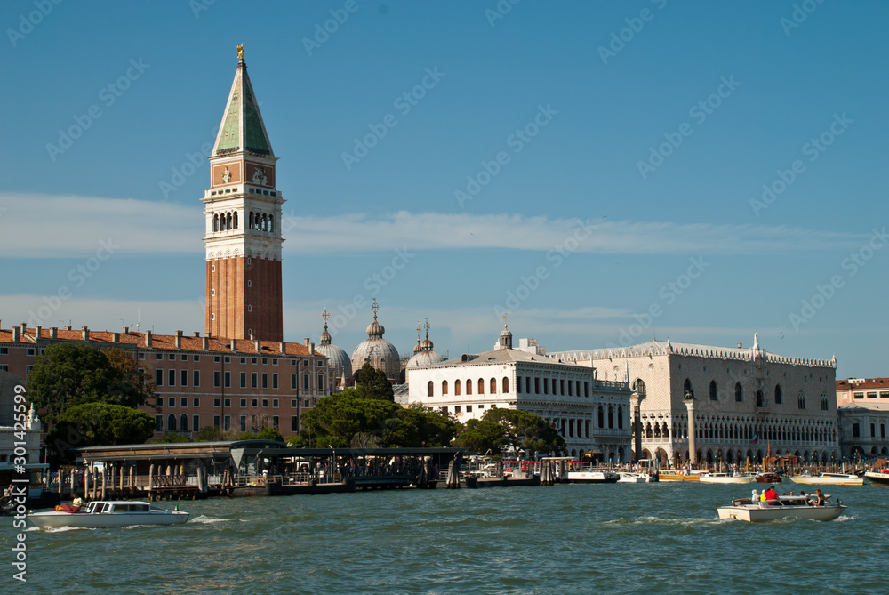 Venice at a sunny day (Italy, Europe): View fro Giudecca Canal of Campanile and Ducale or Doge Palace
