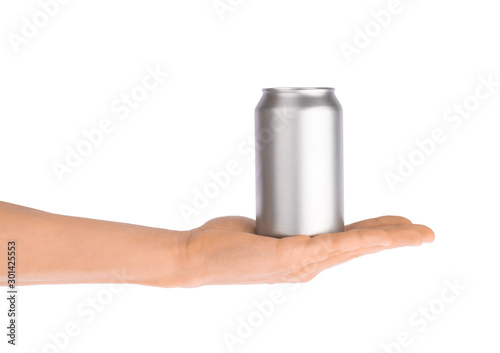 Hand holds metal beverage drink can isolated on white