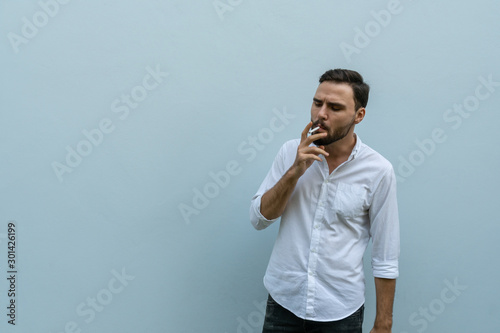 Young man smoking cigaraette outdoor -Image
