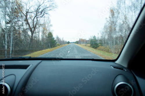 view of the road from the window of a moving car. © Sergei Zub