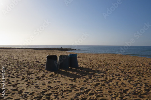 Trash cans on the beach recycling 