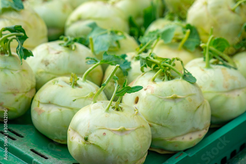 A bunch of fresh kohlrabi on a vegetable market