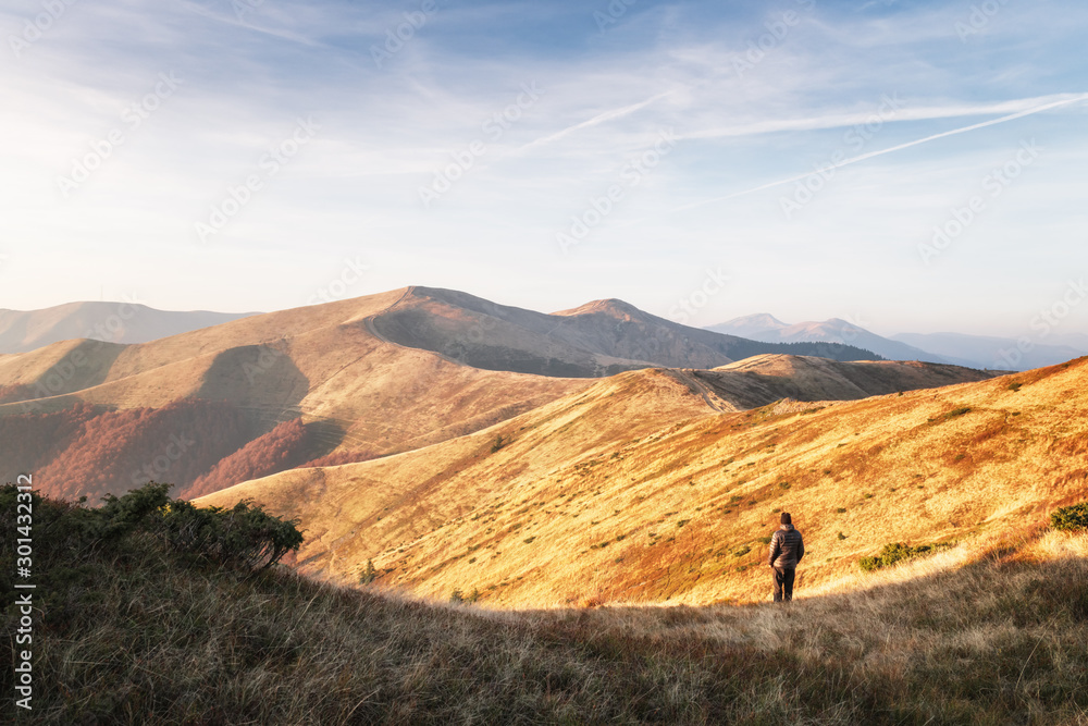 Man silhouette on autumn mountains. Travel concept. Landscape photography