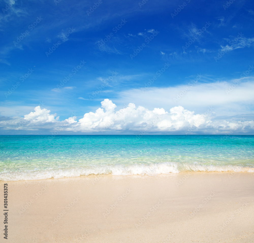 Sea and sky. Perfect blue sea water and blue sky with white fluffy clouds. beautiful beach and tropical sea