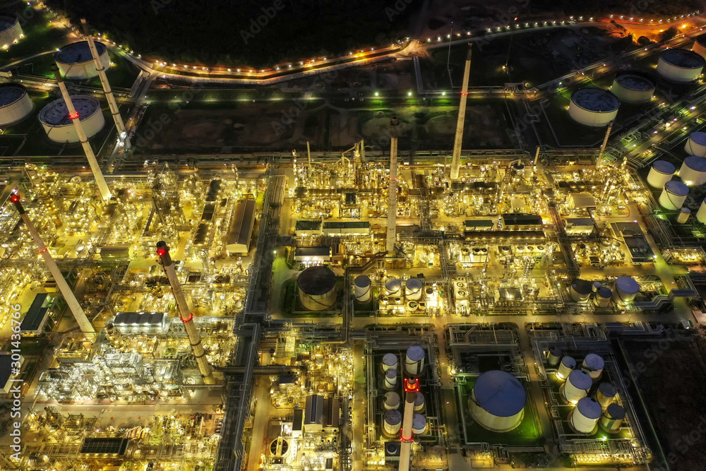Aerial view of twilight petrochemical oil refinery plants,sea ...
