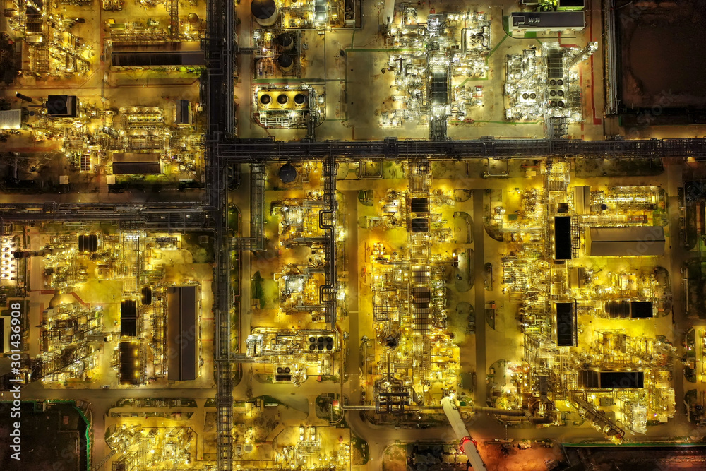 Aerial view of twilight petrochemical oil refinery plants,sea ...