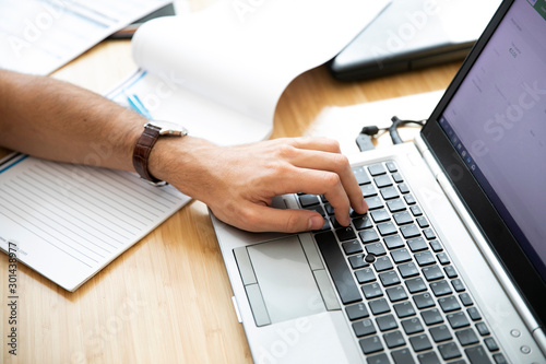 hand using computer in desk