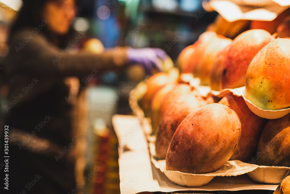 Mango fruit on food market close-up