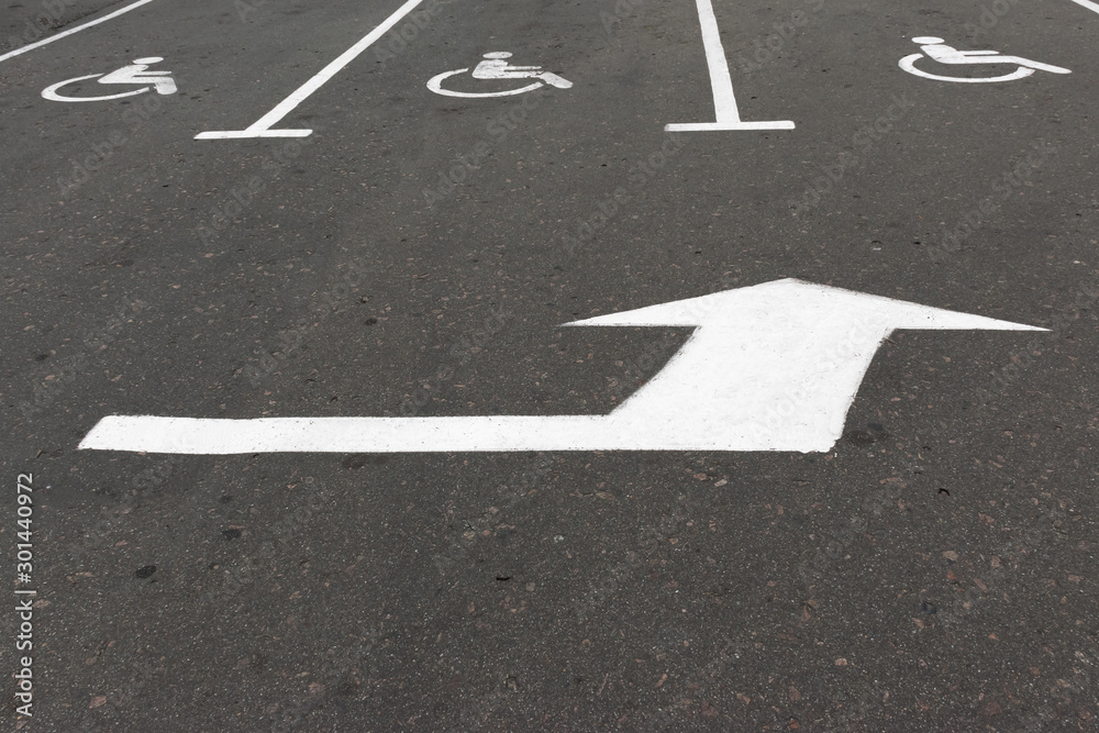Road marking on the asphalt with parking spaces for the disabled Road marking on the asphalt with parking spaces for the disabled