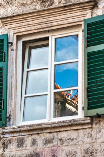 Windows with shutters. Cityscape of the old town.