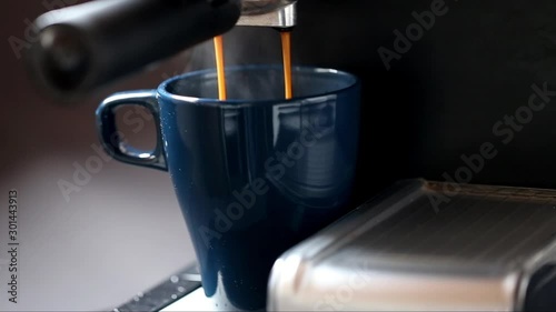 Espresso machine pouring coffee in the cup, double espresso barista coffee concept