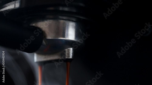Closeup of espresso machine pouring coffee,double espresso barista coffee concept