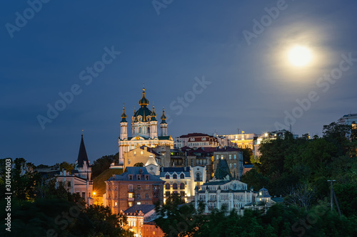 Evening Kiev, panorama of the evening city, the moon shines over the city, Kiev, Ukraine © Andrii Marushchynets
