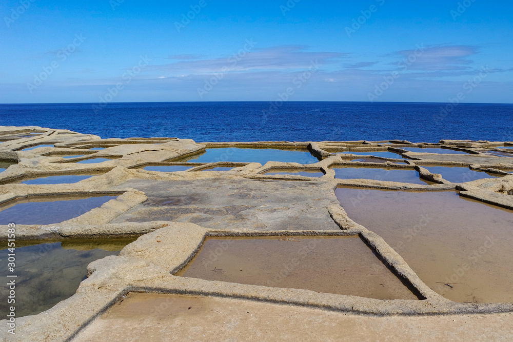Salt evaporation ponds or salterns or salt pans near Qbajjar of Gozo, Marsalforn, Malta