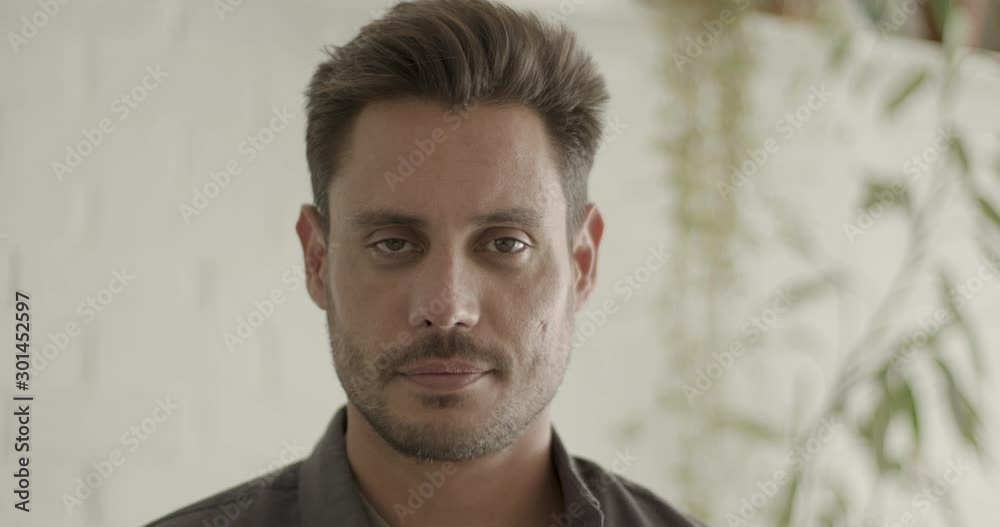 Portrait of Latin male looking content at camera Portrait of Latin male looking content at camera