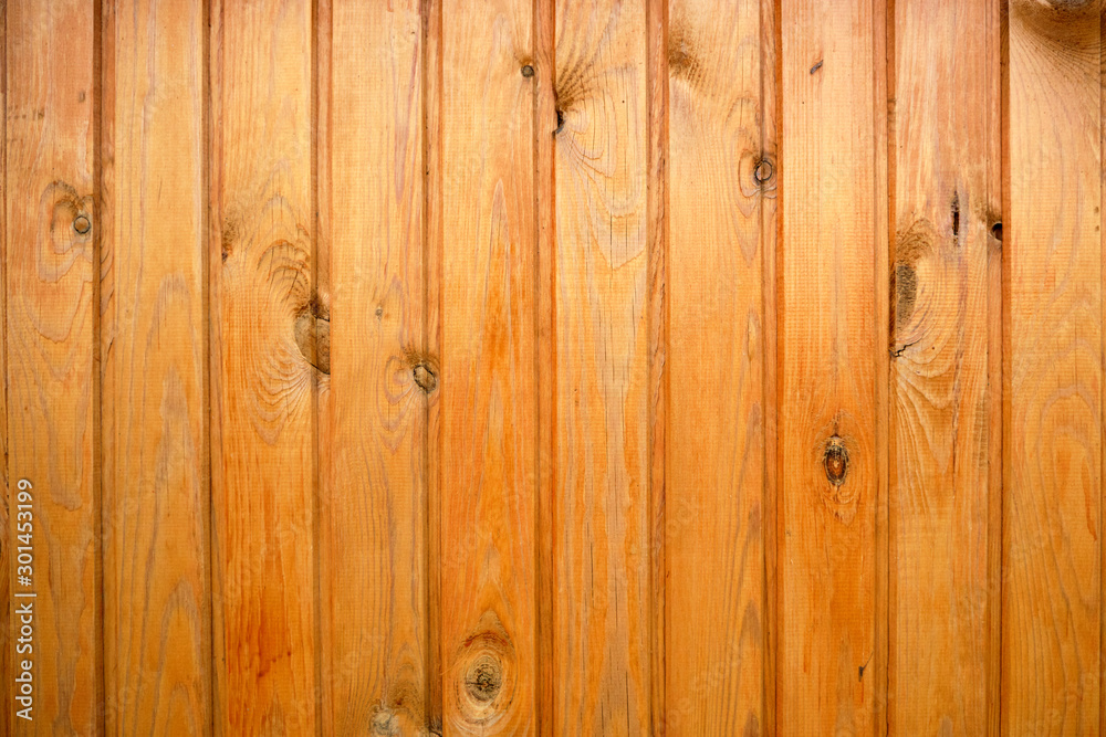 Naklejka premium Background of wooden boards painted with stain in yellow.
