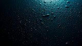 water drops on a plastic blue background in the dark