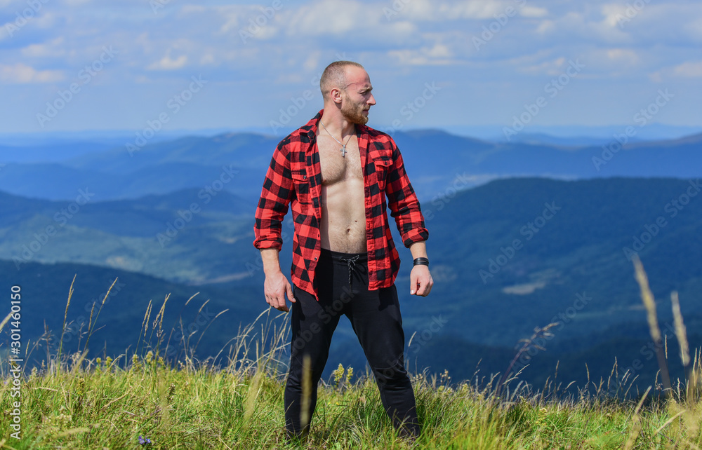 muscular male. cowboy in hat outdoor. sexy macho man in checkered shirt. man  on mountain landscape. camping and hiking. countryside concept. farmer on  rancho. travelling adventure. hipster fashion foto de Stock