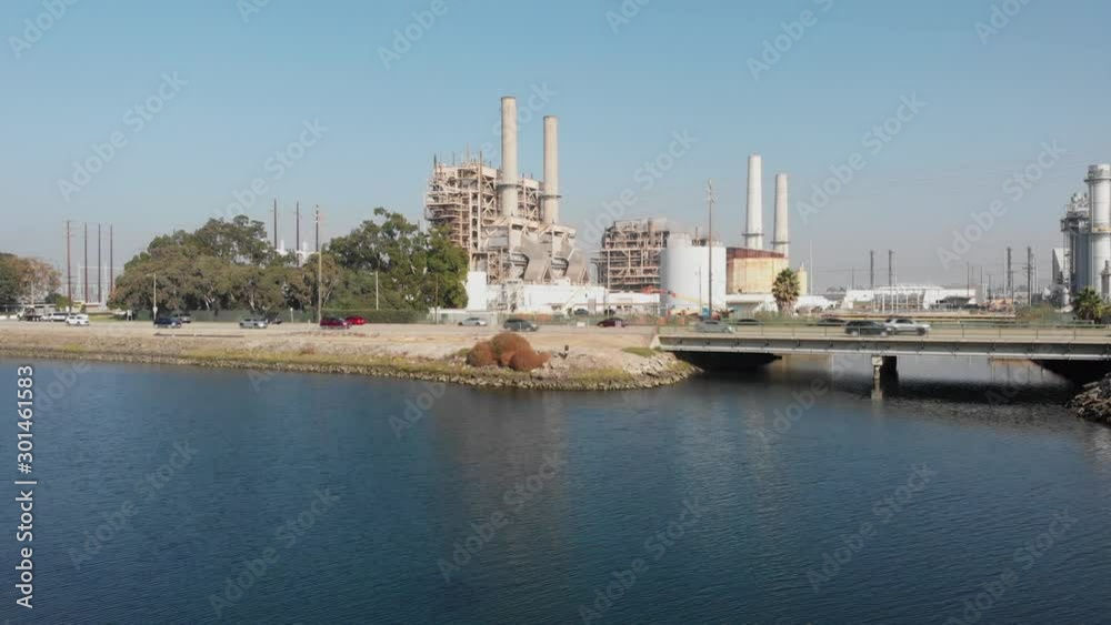 Aerial dolly toward AES Alamitos Natural Gas Plant, Long Beach, California