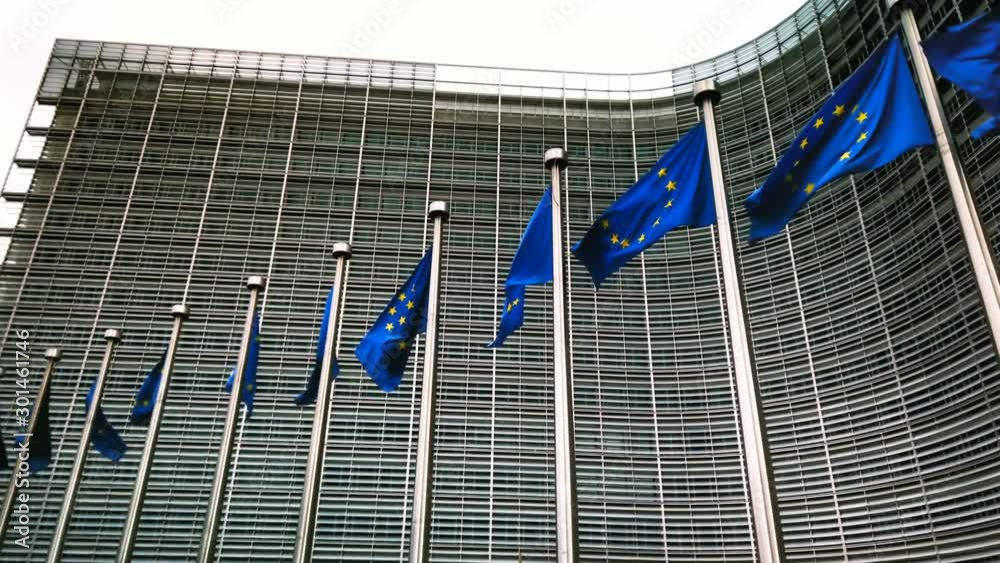 custom made wallpaper toronto digitalWaving EU flags in front of European Commission, Brussels