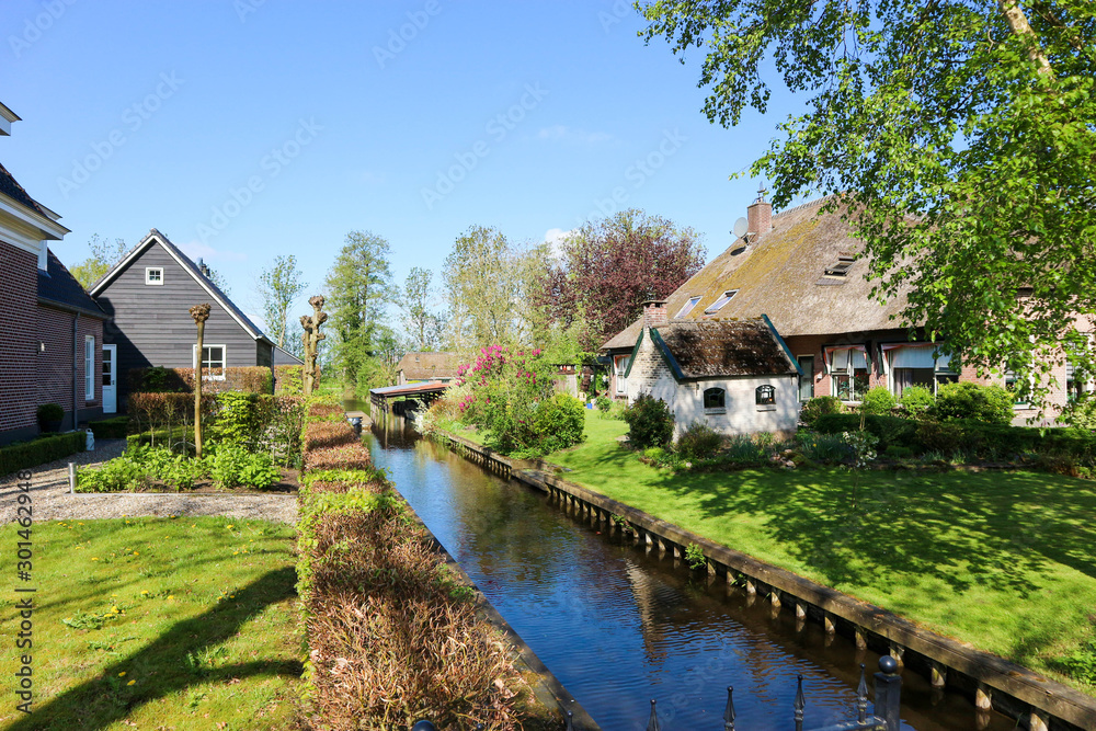 Rural holland landscape - cosy house on canal in small town Giethoorn, Netherlands