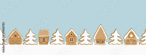 Christmas background. Gingerbread village. Seamless border. There are gingerbread houses and fir trees on a blue background. Greeting card template. Vector illustration