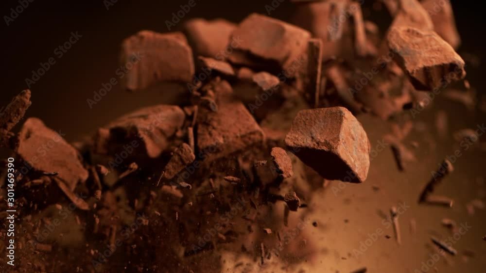 Super slow motion of flying group of raw chocolate pieces. Filmed on high speed cinema camera, 1000fps. Super slow motion of flying group of raw chocolate pieces. Filmed on high speed cinema camera, 1000fps.