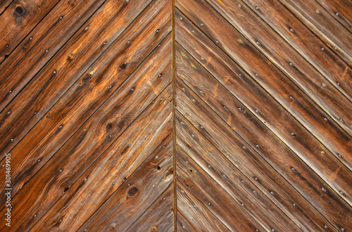 Wooden background, vintage rotten planks that survived on an old 18th century barn, Ohio USA