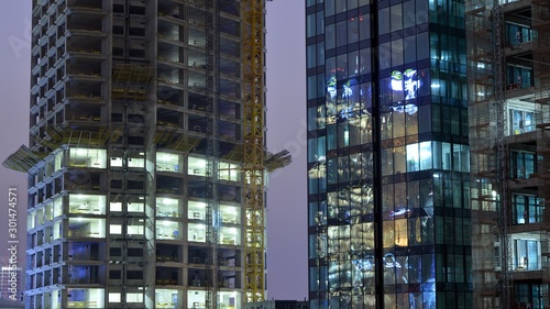 The building under construction illuminated at night