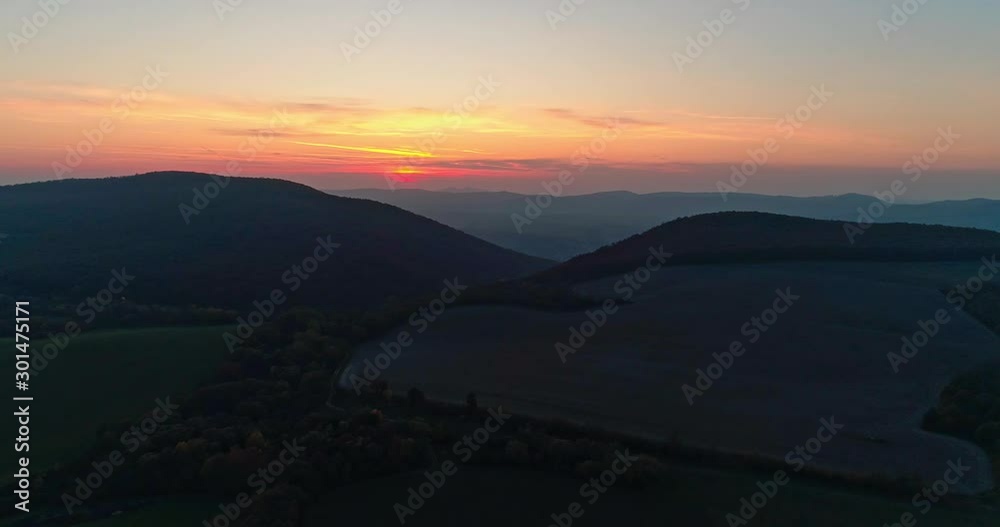 Autumn forest drone aerial shot at sunset. Overhead view of foliage trees in Hungary. Inspiring autumn season landscape panorama. Autumn forest drone aerial shot at sunset. Overhead view of foliage trees in Hungary. Inspiring autumn season landscape panorama.