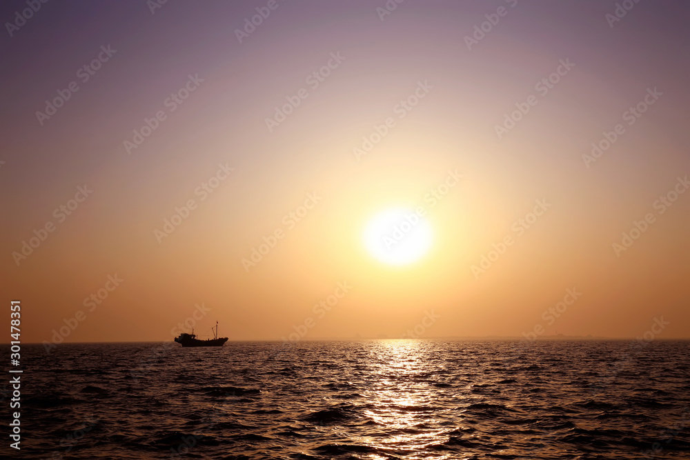 The fishing boats docked at the sea