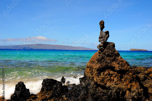 Stacked rocks on the shoreline of Little Beach on Maui  Hawaii. 