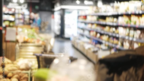 Wallpaper Mural girl in the store buys cucumber greens healthy food. Fun shakes with cucumber Torontodigital.ca