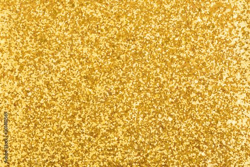 Golden, shiny and sparkling background texture. For New Year cards with lights.