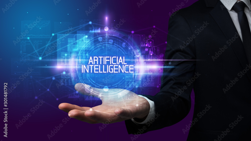 Man hand holding ARTIFICIAL INTELLIGENCE inscription, technology concept Man hand holding ARTIFICIAL INTELLIGENCE inscription, technology concept
