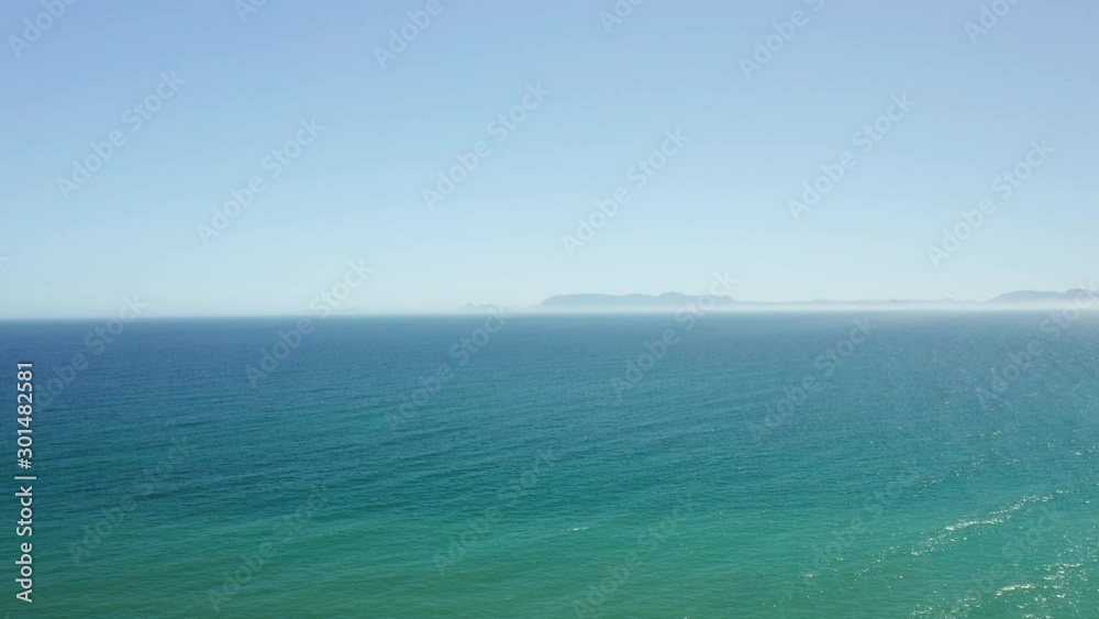 Pan Shot from a Drone Flying Over the Ocean and a View of the White Sand Beach Pan Shot from a Drone Flying Over the Ocean and a View of the White Sand Beach