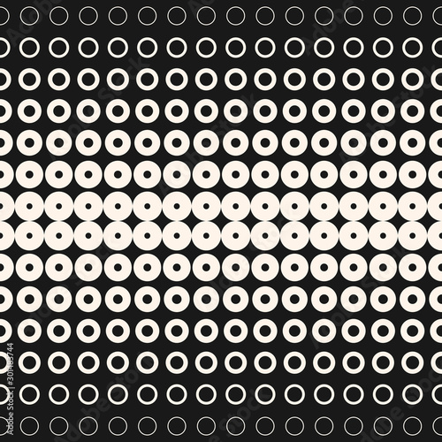 Halftone circles and rings. Monochrome geometric seamless pattern