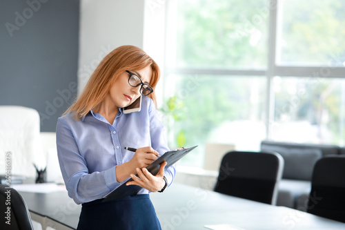 Portrait of stylish mature businesswoman in office