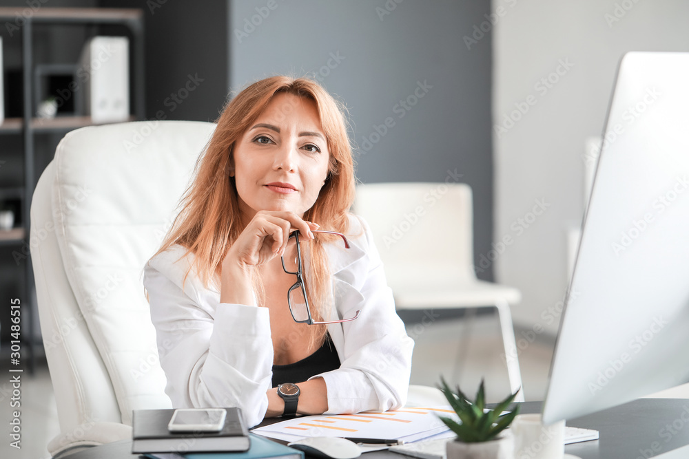 Portrait of mature businesswoman in office Portrait of mature businesswoman in office