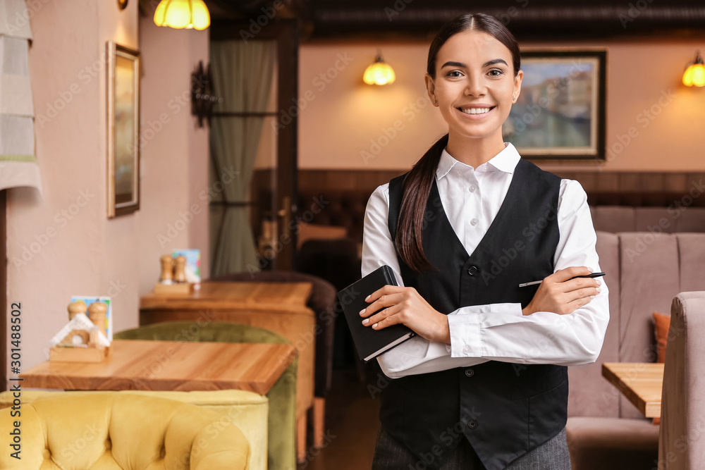 Portrait of young waitress in restaurant Portrait of young waitress in restaurant