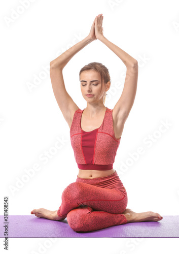 Fototapeta Naklejka Na Ścianę i Meble -  Beautiful young woman practicing yoga on white background