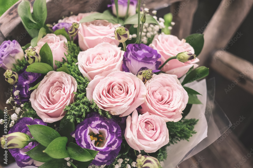 Close up of Violet and pink rose flower bouquet.