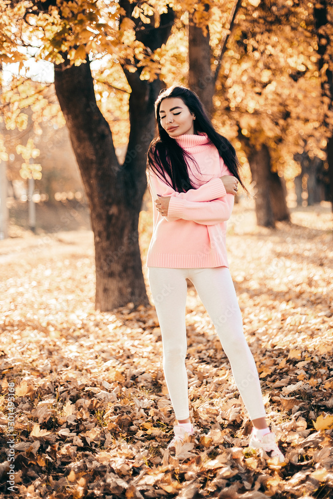 Beautiful model posing for the camera in the park. Beautiful model posing for the camera in the park.