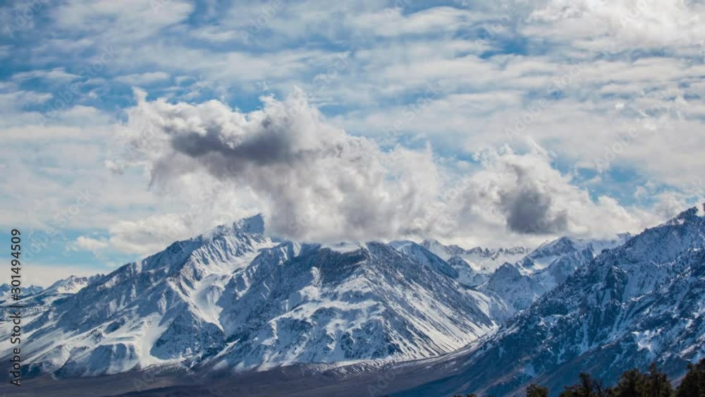 Time Lapse - Cloudscape Moving Over Snowy Mountains Time Lapse - Cloudscape Moving Over Snowy Mountains