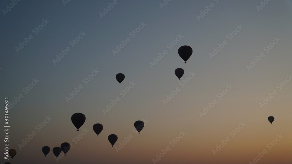 Many hot air balloons above Bagan in Myanmar with sunrise time.